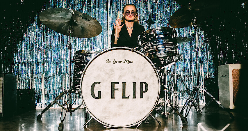 G Flip plays drums.