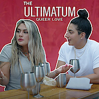 Dayna and Magan seated at a wooden table with metallic cups against a red background. The text reads: 'The Ultimatum: Queer Love.'