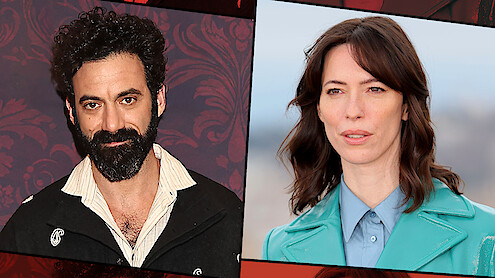 Two people are pictured side by side; the man on the left has curly dark hair and a beard, standing against a dark red patterned background, while the woman on the right has brown hair and wears a teal coat, outside with a blurred background.