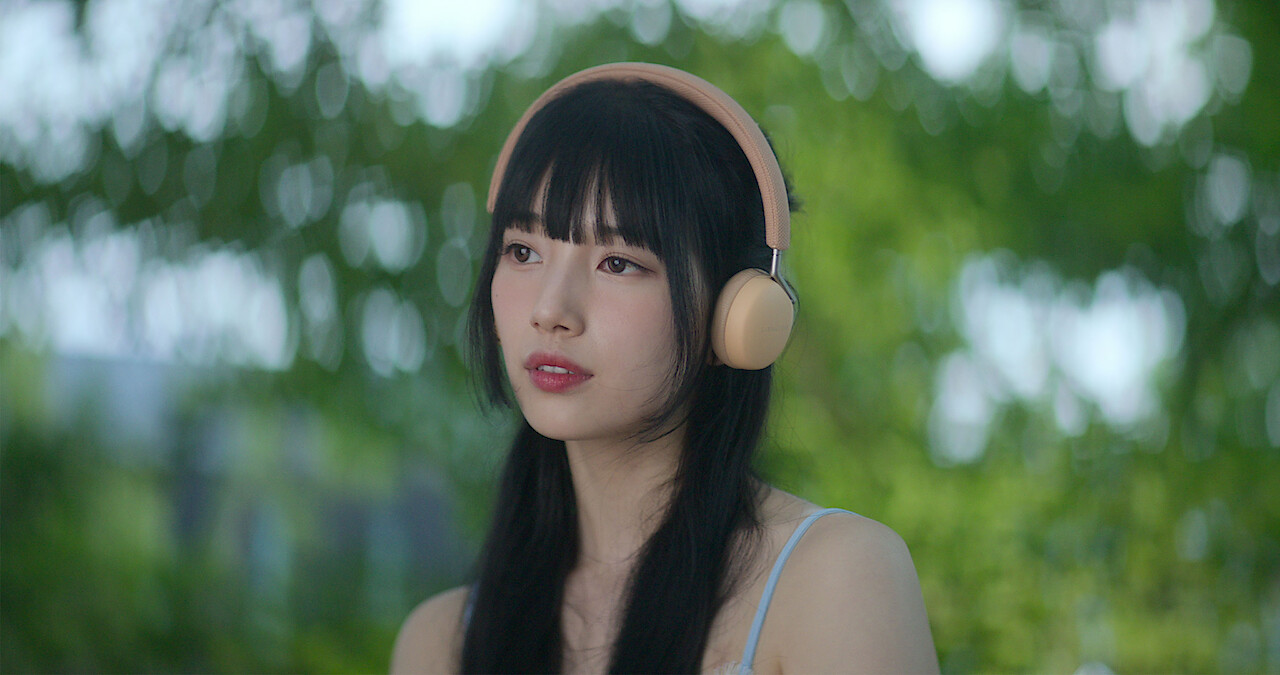 Bae Suzy as Doona in Doona! (Asian woman wearing pink headphones)
