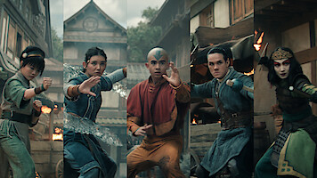 Five costumed characters in dynamic fighting stances, each displaying unique powers, stand in a row on a village street with traditional buildings and fire in the background, suggesting an action or fantasy scene.