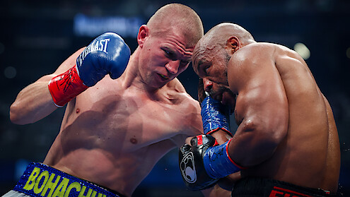 Serhii Bohachuk lands a left at Brandon Adams during their middleweight bout at Allegiant Stadium.