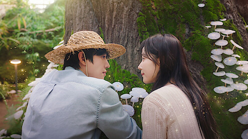 Ahn Hyo-seop as Matthew and and Chae Won-been as Ye-jin observe mushrooms in 'Sold Out on You.'