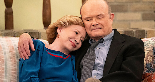 Debra Jo Rupp as Kitty and Kurtwood Smith as Red cuddle together on a couch in Part 2 of 'That '90s Show'