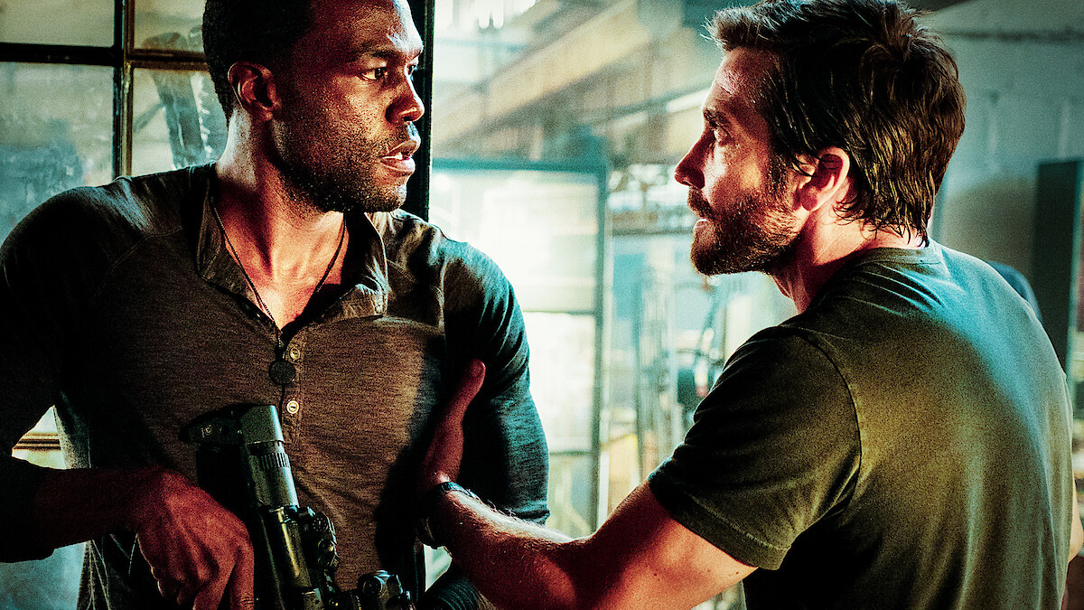 Yahya Abdul-Mateen II as Will Sharp and Jake Gyllenhaal as Danny Sharp argue in 'Ambulance.'  