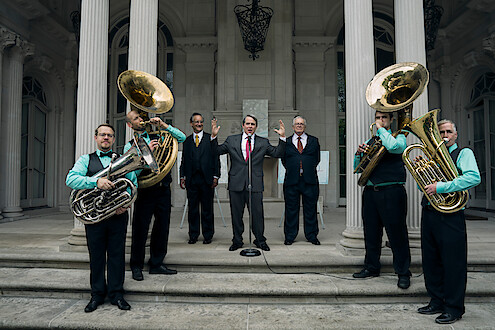 a band playing in front of a building