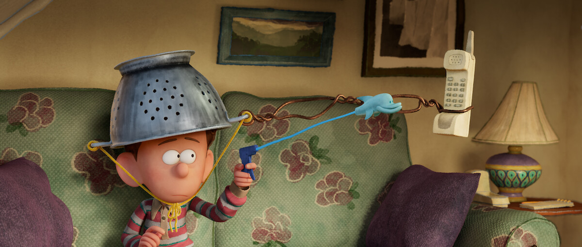 Orion holds a phone with a pincer in a still from ‘Orion and the Dark.’