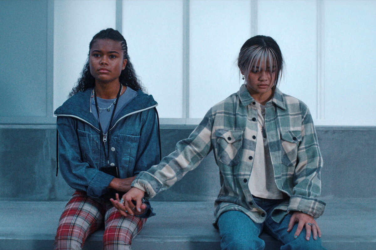 Tamara Smart as Young Jade Wesker and Siena Agudong as Young Billie Wesker share a moment in 'Resident Evil.'