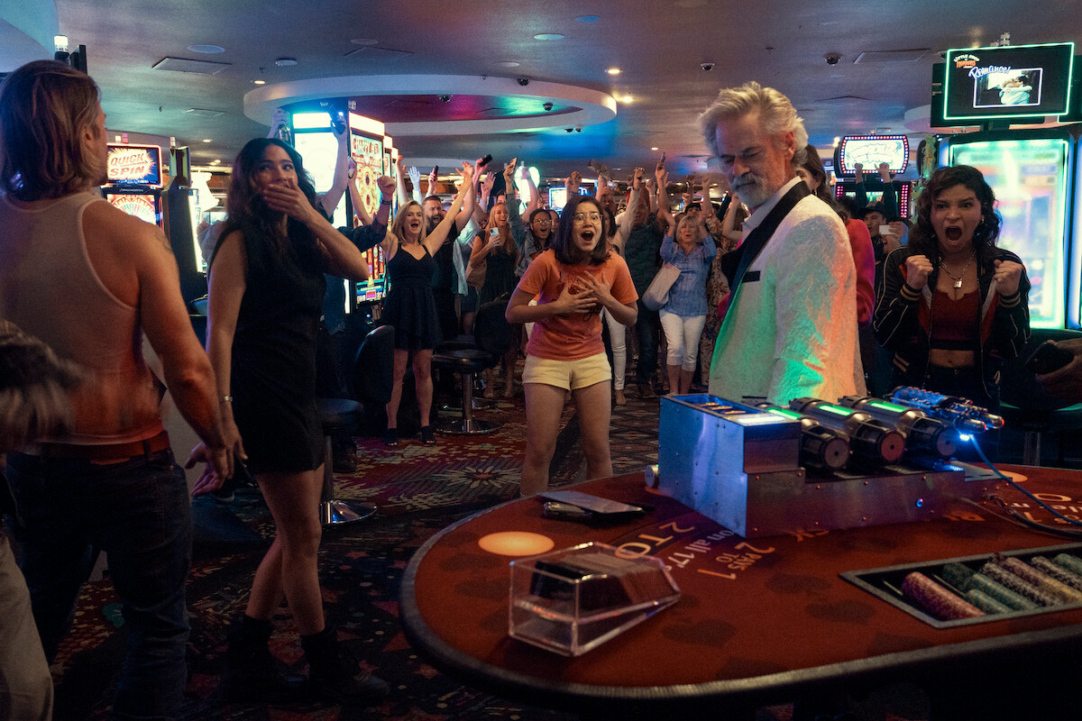Nick Zano as Chad McKnight, Shelley Hennig as Ava Winters, Kimi Rutledge as Maya Lerner, C. Thomas Howell as Hagerty, and Paola Lázaro as Angela Gomez celebrate in a casino together in Season 1 of ‘Obliterated’