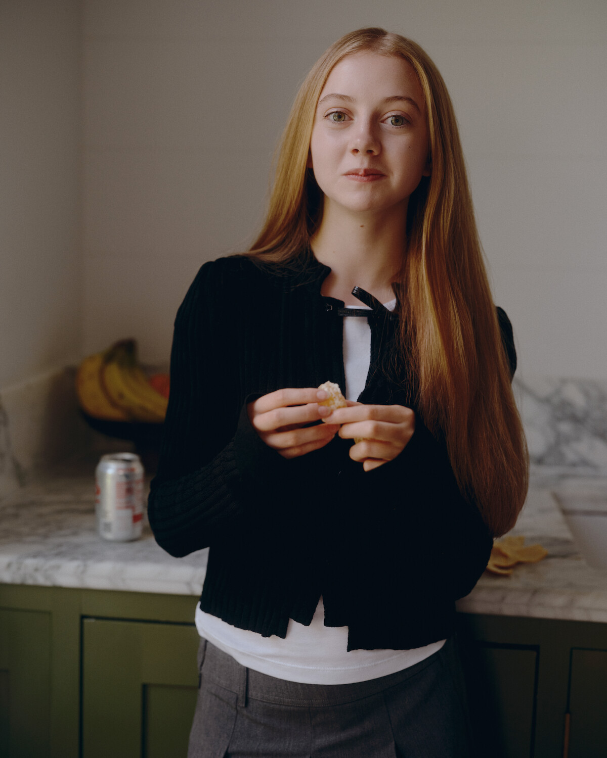Evie Templeton eating an orange.