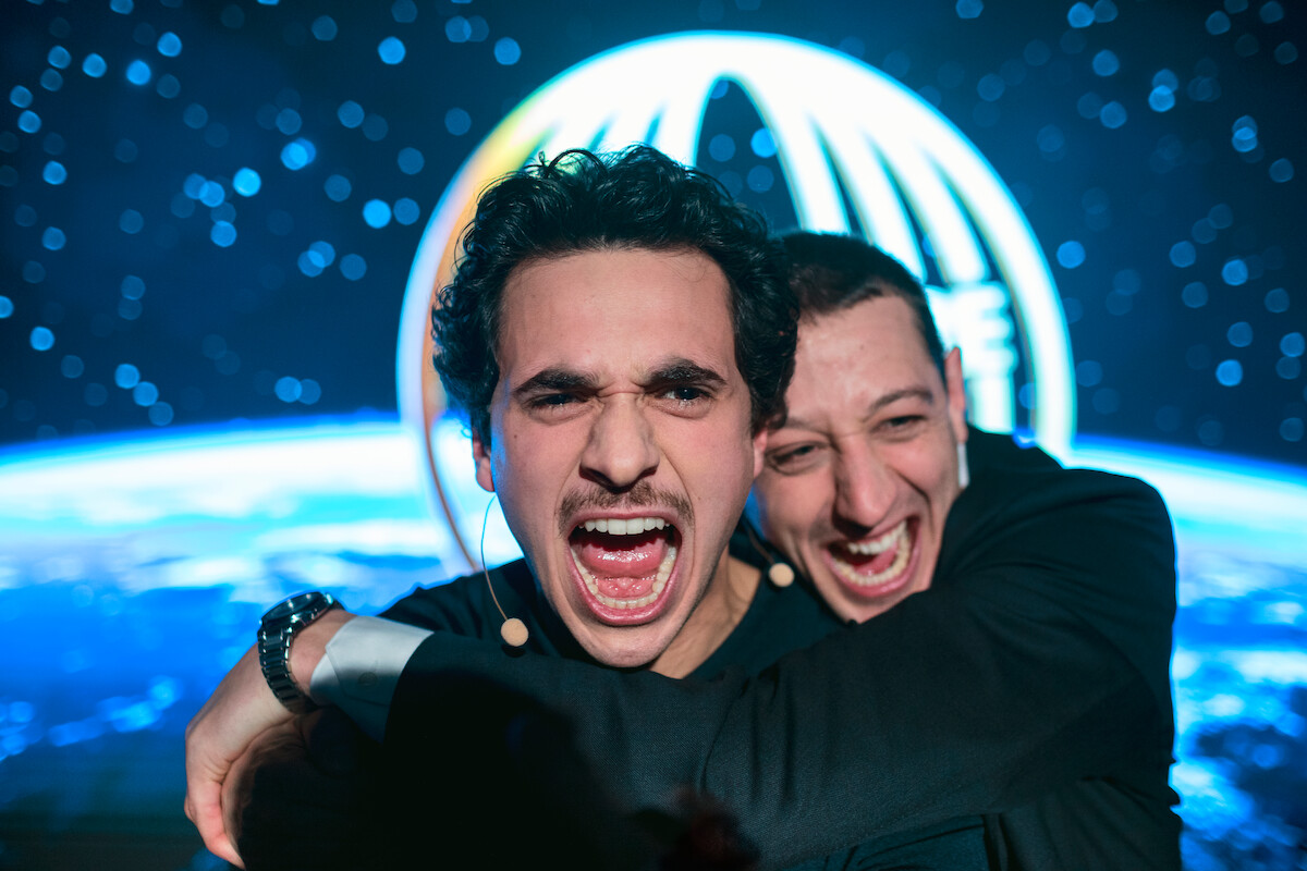 Shahine El-Hamus as Amir and Minne Koole as Roy yell in excitement in ‘Crypto Boy.’