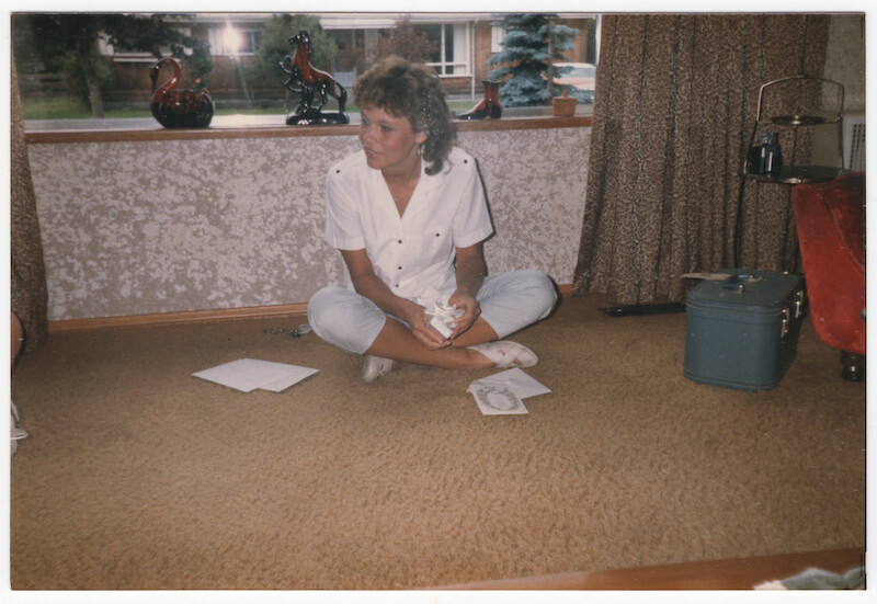 Pamela sitting on the floor.