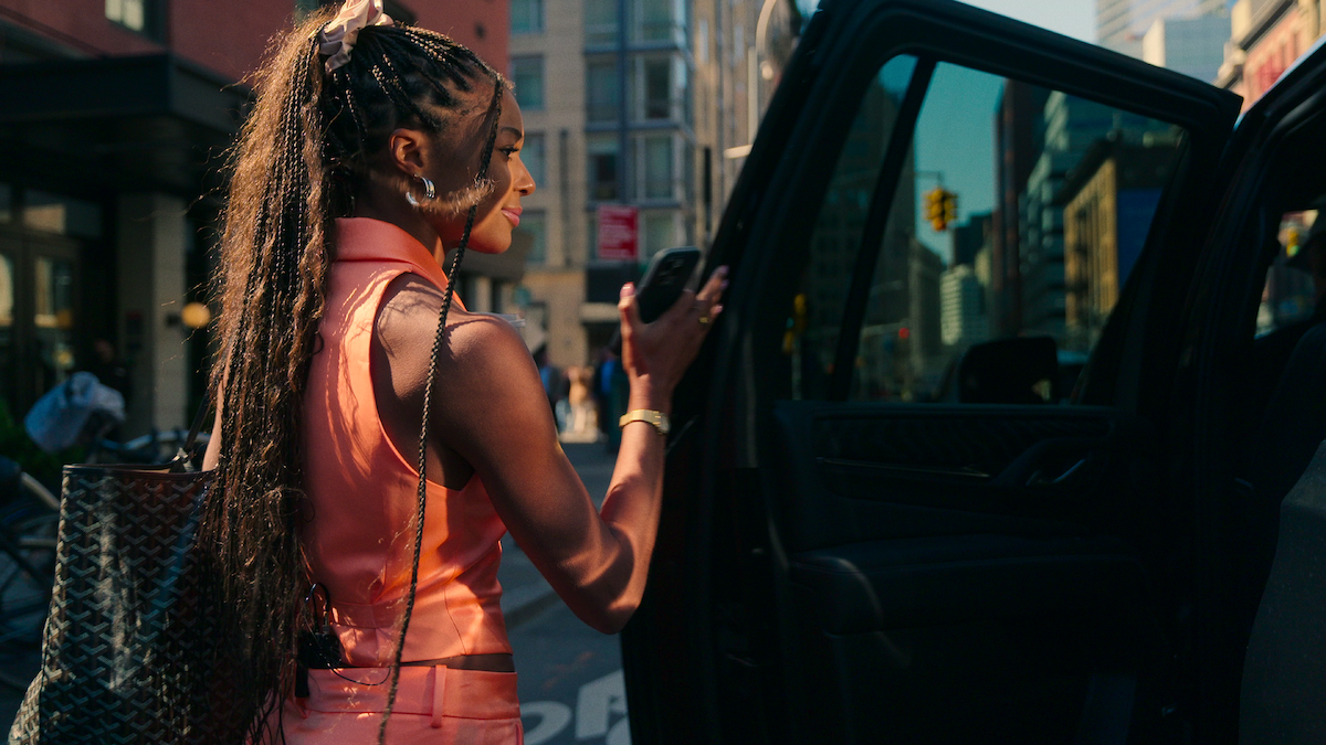 Gabby Thomas entering a car.