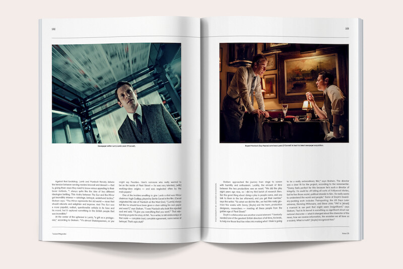 Open magazine showing two pages: left page features a man in a suit near printing press machinery; right page shows three people in a warmly lit room at a table, engaged in conversation, surrounded by framed pictures and paintings.