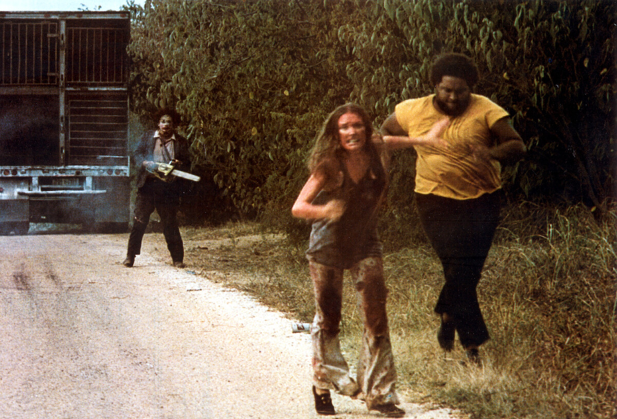 People running away from the original Leatherface