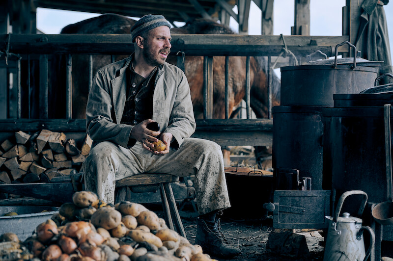 Stanislaus Katczinsky peels potatoes in ‘All Quiet On The Western Front.’ ‘All Quiet on the Western Front’ First Look Photos