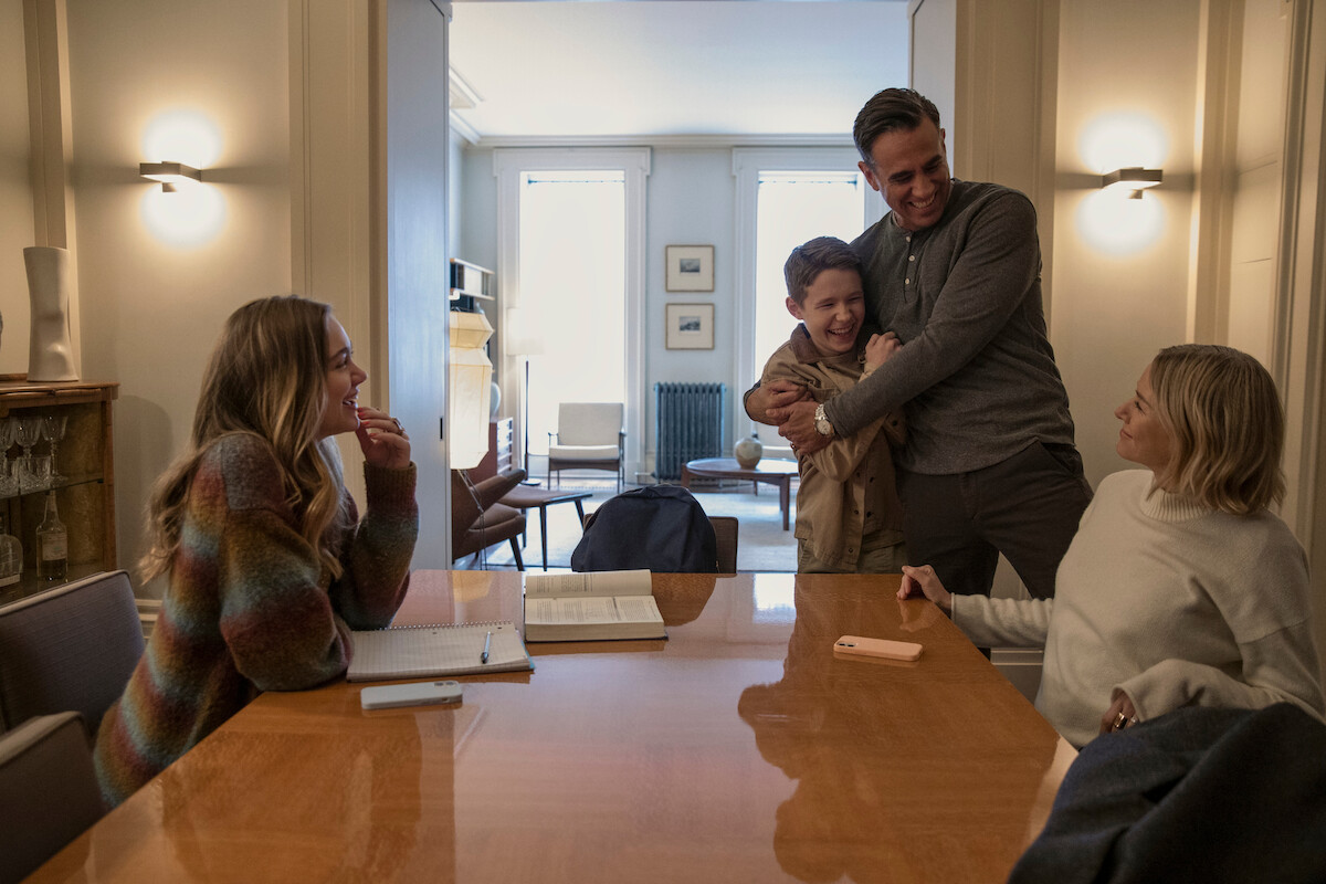 The Brannock family during a rare moment of peace sitting around a dining room table.