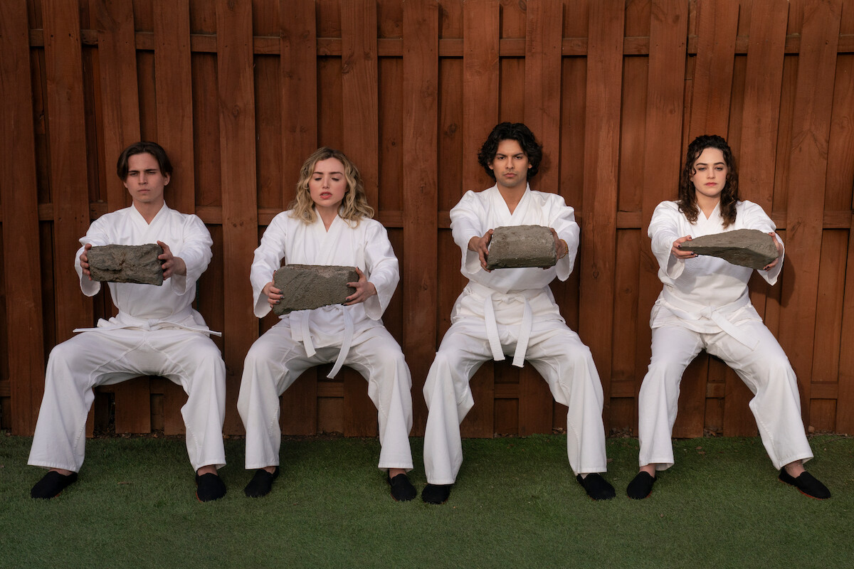 Tanner Buchanan as Robby Keene, Peyton List as Tory Nichols, Xolo Maridueña as Miguel Diaz, Mary Mouser as Samantha LaRusso in ‘Cobra Kai’