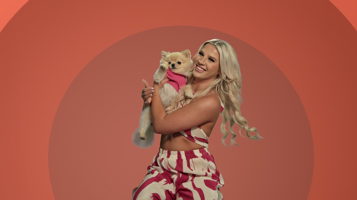 Savannah holding a dog