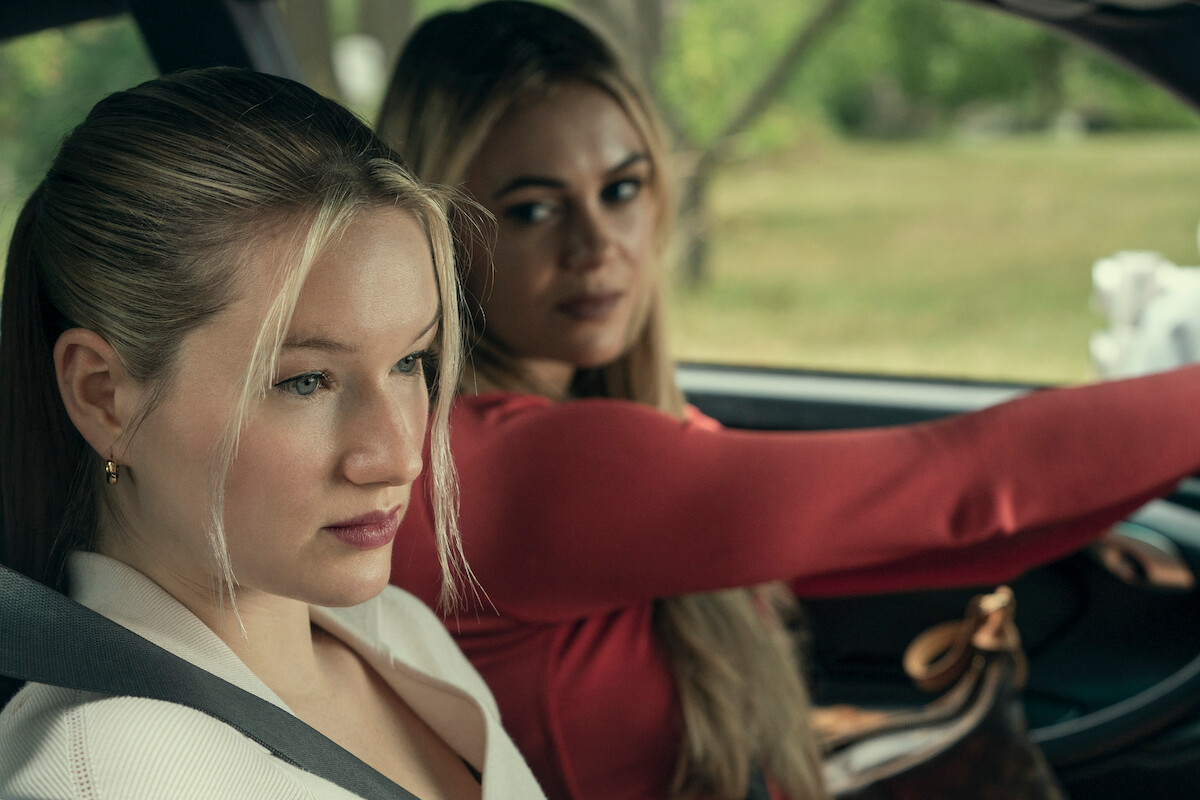 West Duchovny as Shannon Shaeffer and Dina Shihabi as Britt Hufford sit in a car together in Season 1 of ‘Painkiller.’