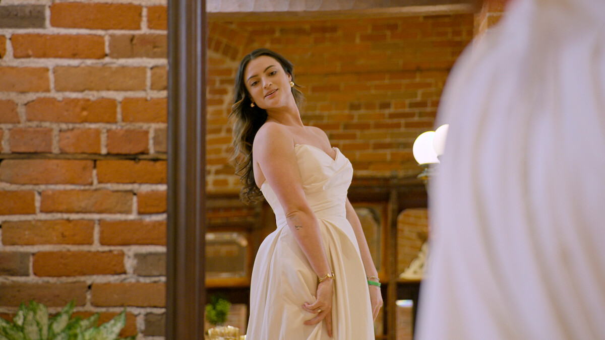 Monica trying on her wedding dress.