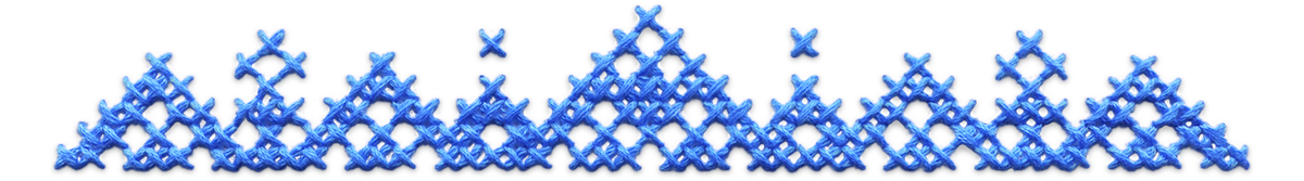 Ornate blue cross stitched top divider.