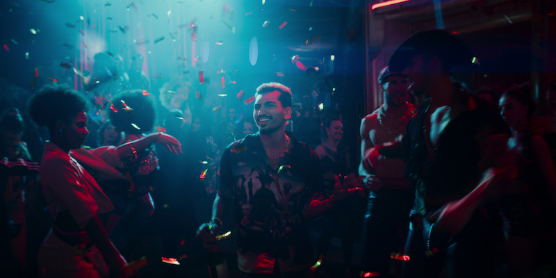 Nabhaan Rizwan as Dionysus walks through a club in Season 1 of ‘Kaos’