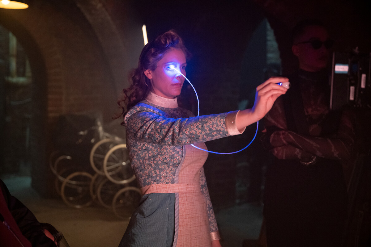Jordan Claire Robbins as Grace Hargreeves of ‘The Umbrella Academy’ series posing behind the scenes during production.
