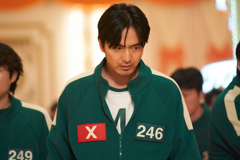 Lee Jin-uk as Park Gyung-seok wears a green track suit in Season 2 of 'Squid Game'