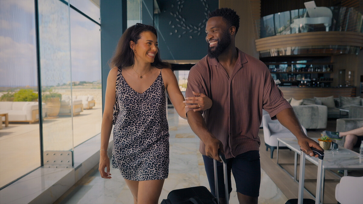 Javen and Katisha smiling as they walk side by side.