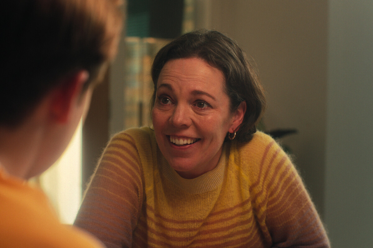 Olivia Colman as Sarah Nelson smiles wearing a yellow sweater in Season 1 of ‘Heartstopper.’