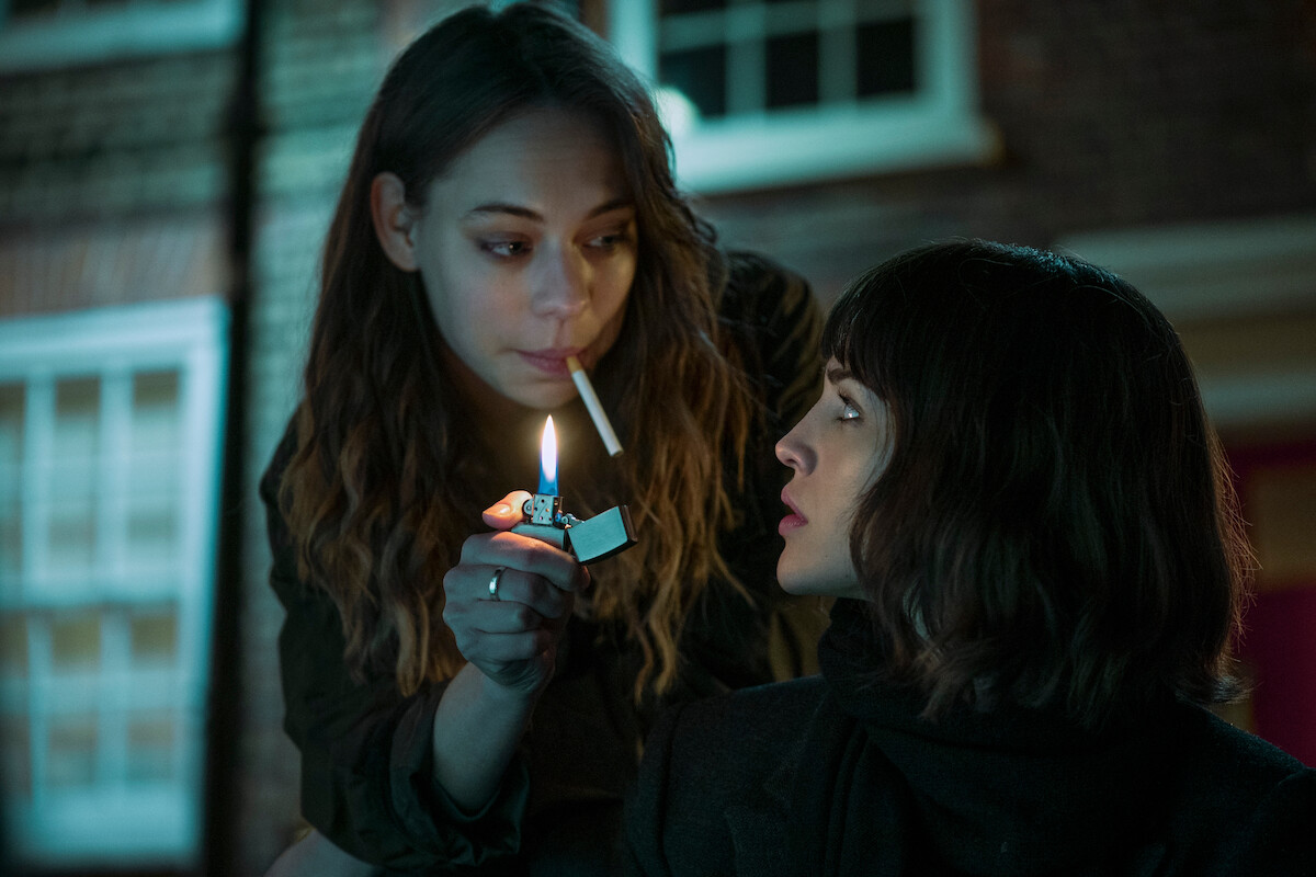 Marlo Kelly as Tatiana, Eiza González as Auggie Salazar has her cigarette lit in ‘3 Body Problem.’