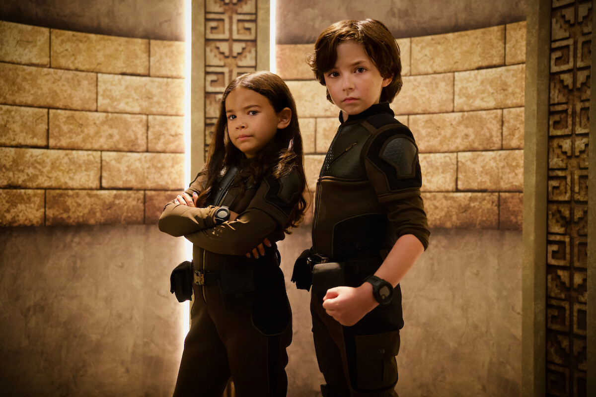 Everly Carganilla and Connor Esterson strike a combat pose in a still from ‘Spy Kids: Armageddon.’