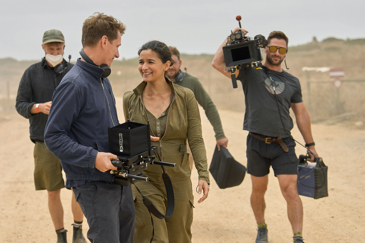 Tom Harper and Alia Bhatt in a behind-the-scenes still from ‘Heart of Stone.’