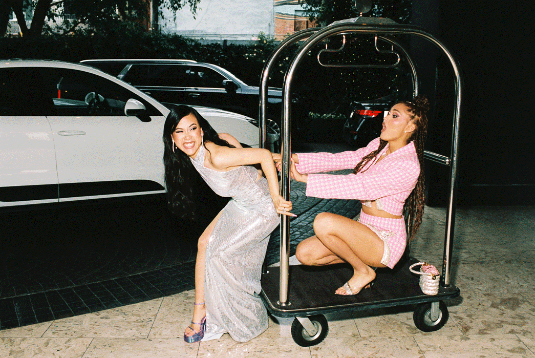 Ramona Young pushes Lee Rodriguez on a luggage cart.