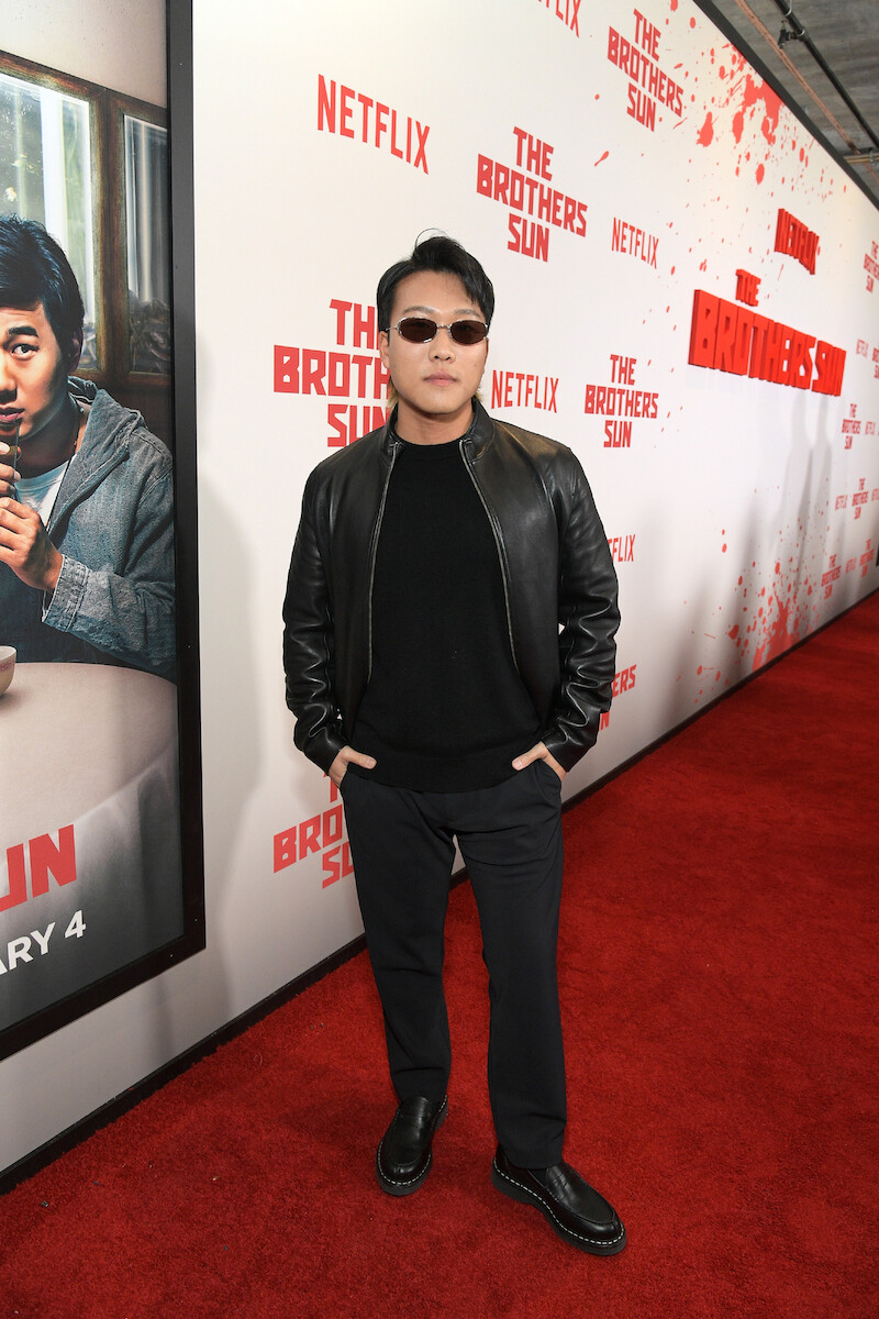 Joon Lee attends Netflix's 'The Brothers Sun' Los Angeles Premiere at Netflix Tudum Theater wearing a black leather jacket and sunglasses