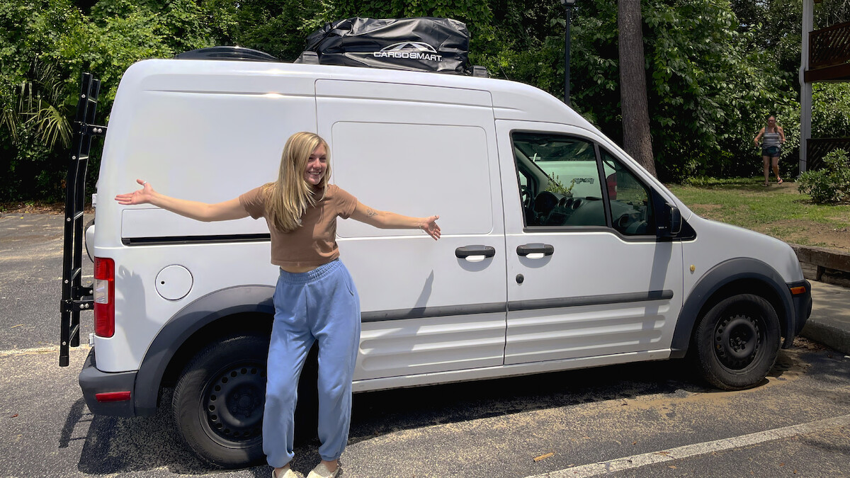 Gabby in front of her van