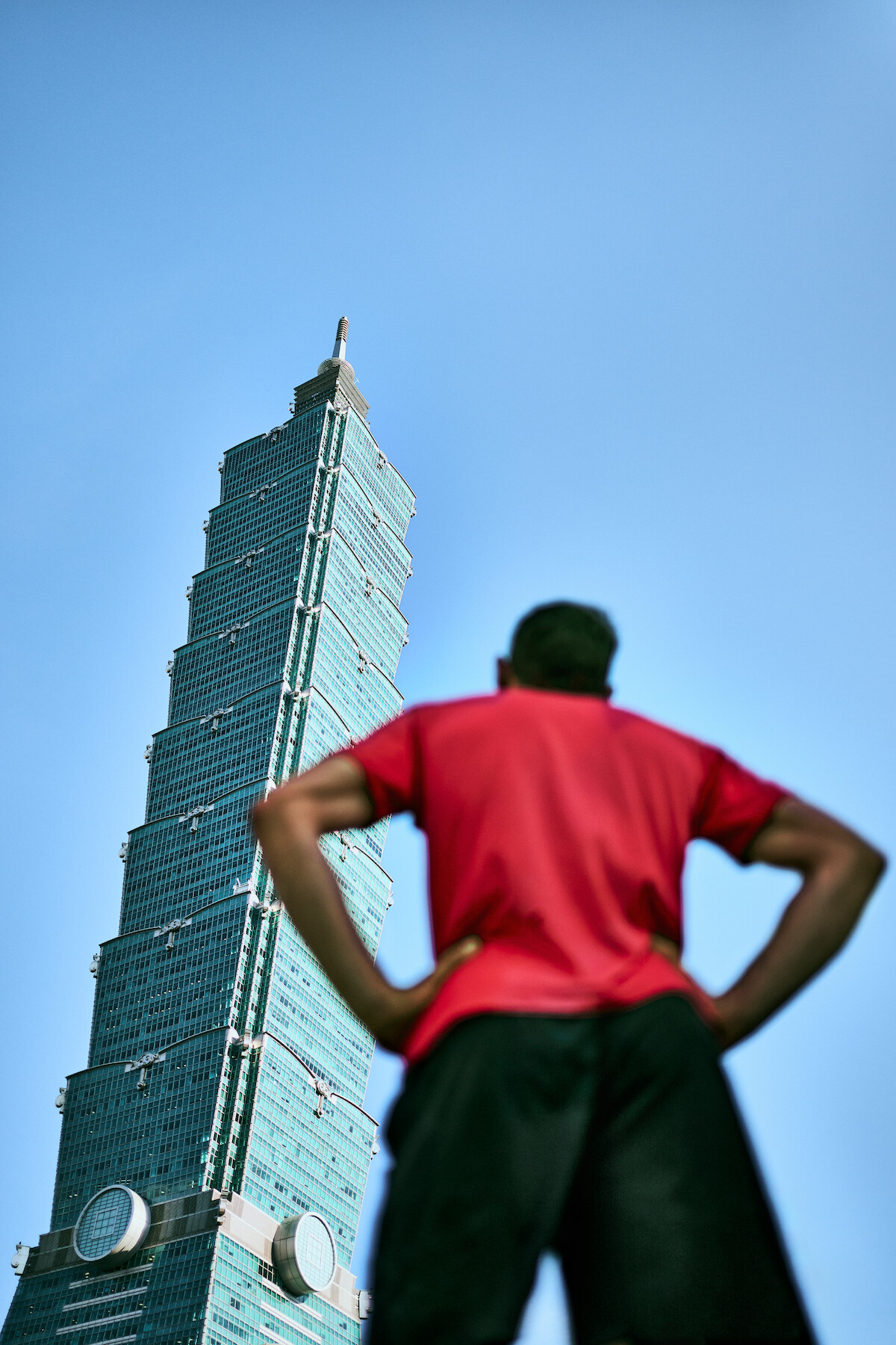 Alex Honnold looks up at Taipei 101 in Taipei, Taiwan.