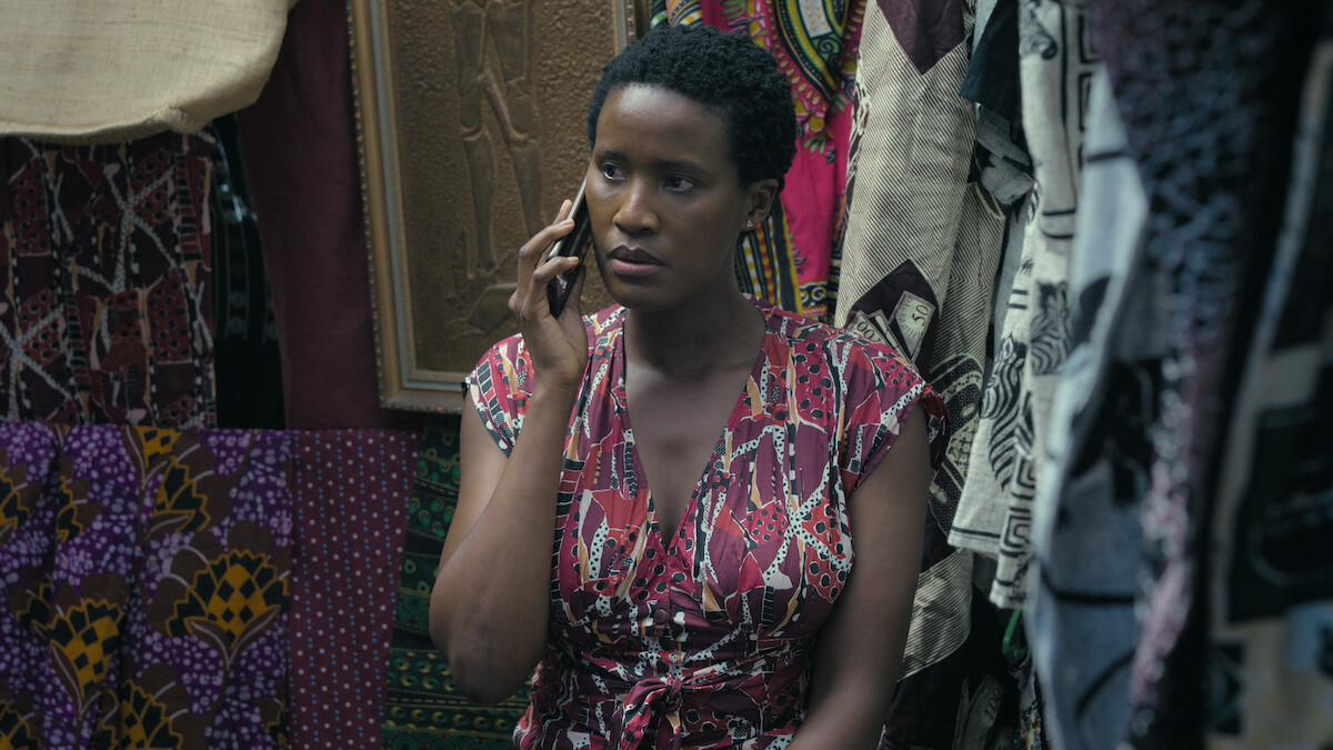 Masasa Mbangeni as Malime Mambi holds a phone to her ear in a still image from the film ‘Heart of the Hunter.’