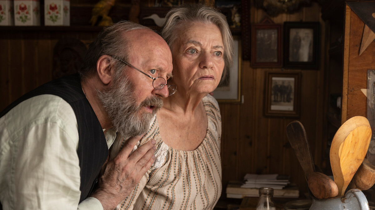 Anna Seniuk and Artur Barciś stare out of a window together in ‘No Pressure.’
