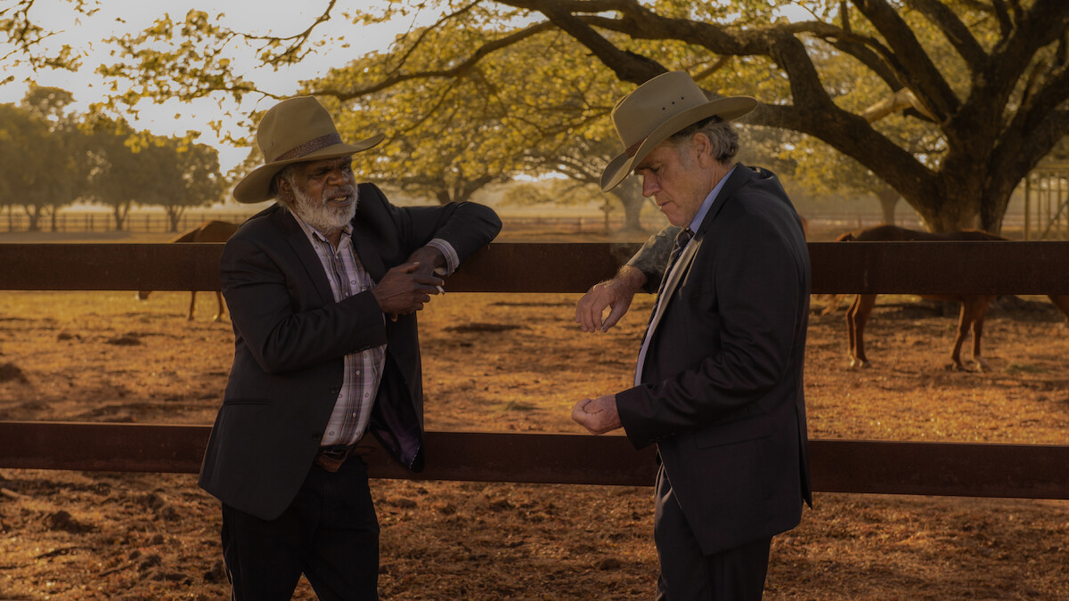 Hamilton Morris as Uncle Bryce and Robert Taylor as Colin Lawson lean on a fence together in Season 1 of 'Territory'