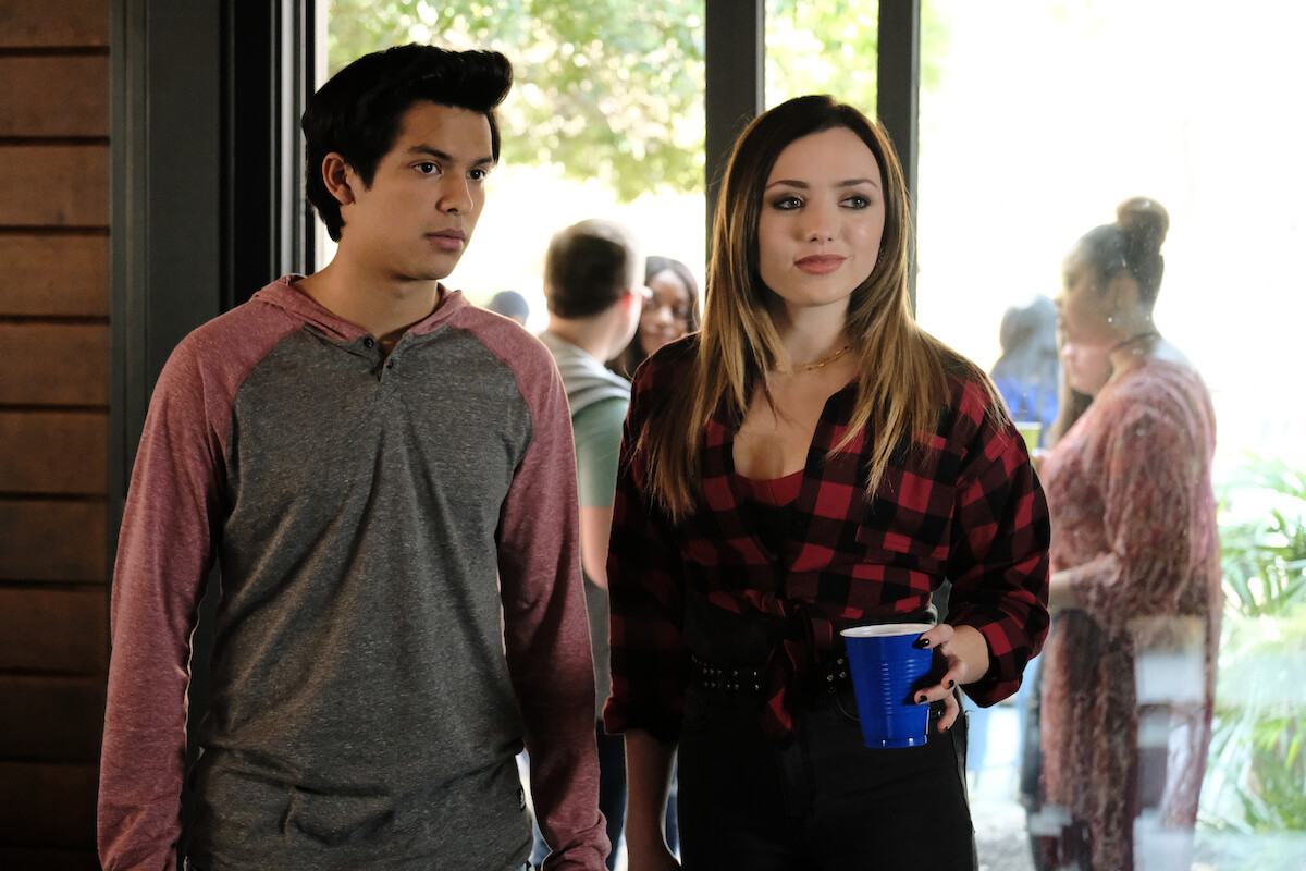 A close up of Cobra Kai characters Miguel and Tory