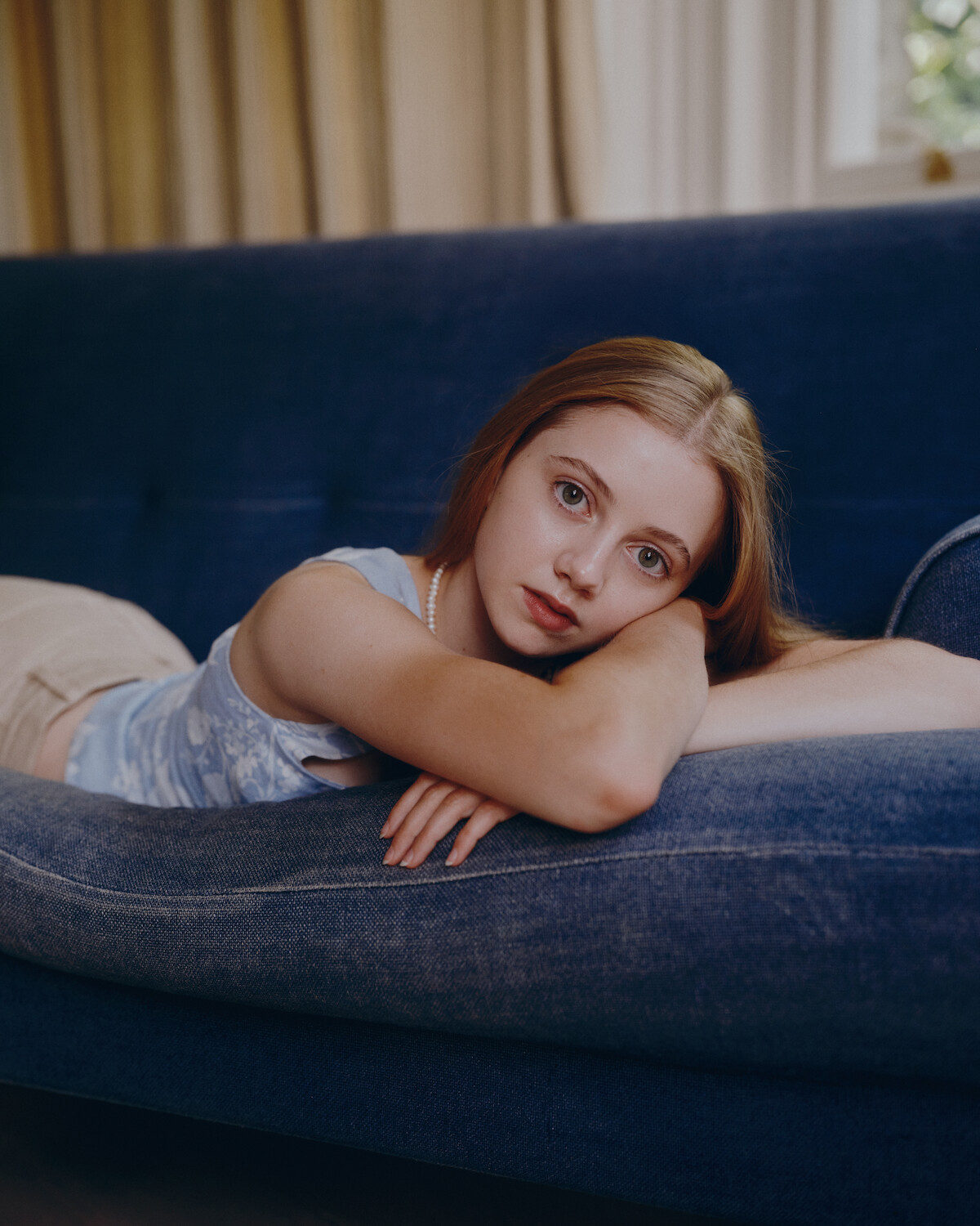 Evie Templeton on a couch.