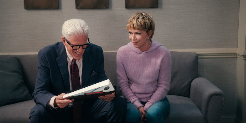  Ted Danson as Charles and Mary Elizabeth Ellis as Emily sit together on a couch in Season 1 of 'A Man on the Inside'