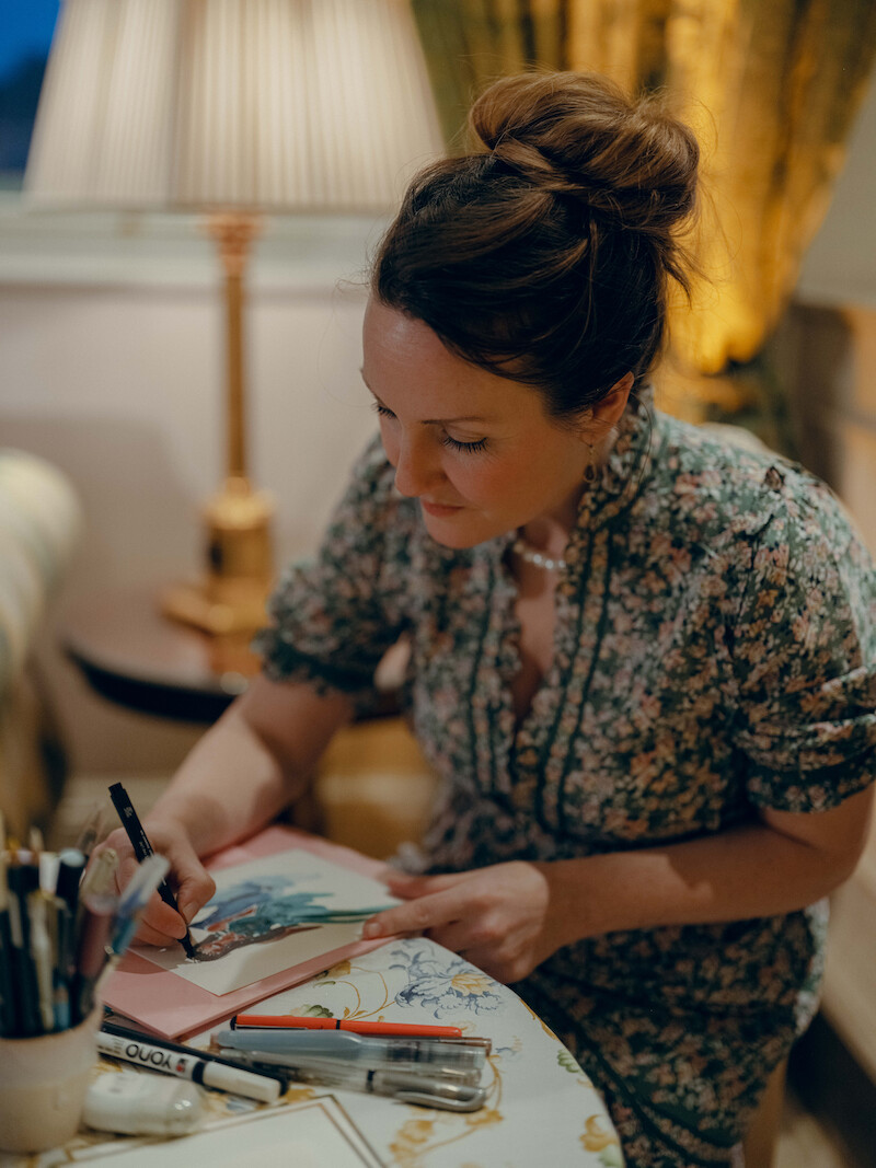 An artist paints in 'The Event of the Season: A Bridgerton Wedding'
