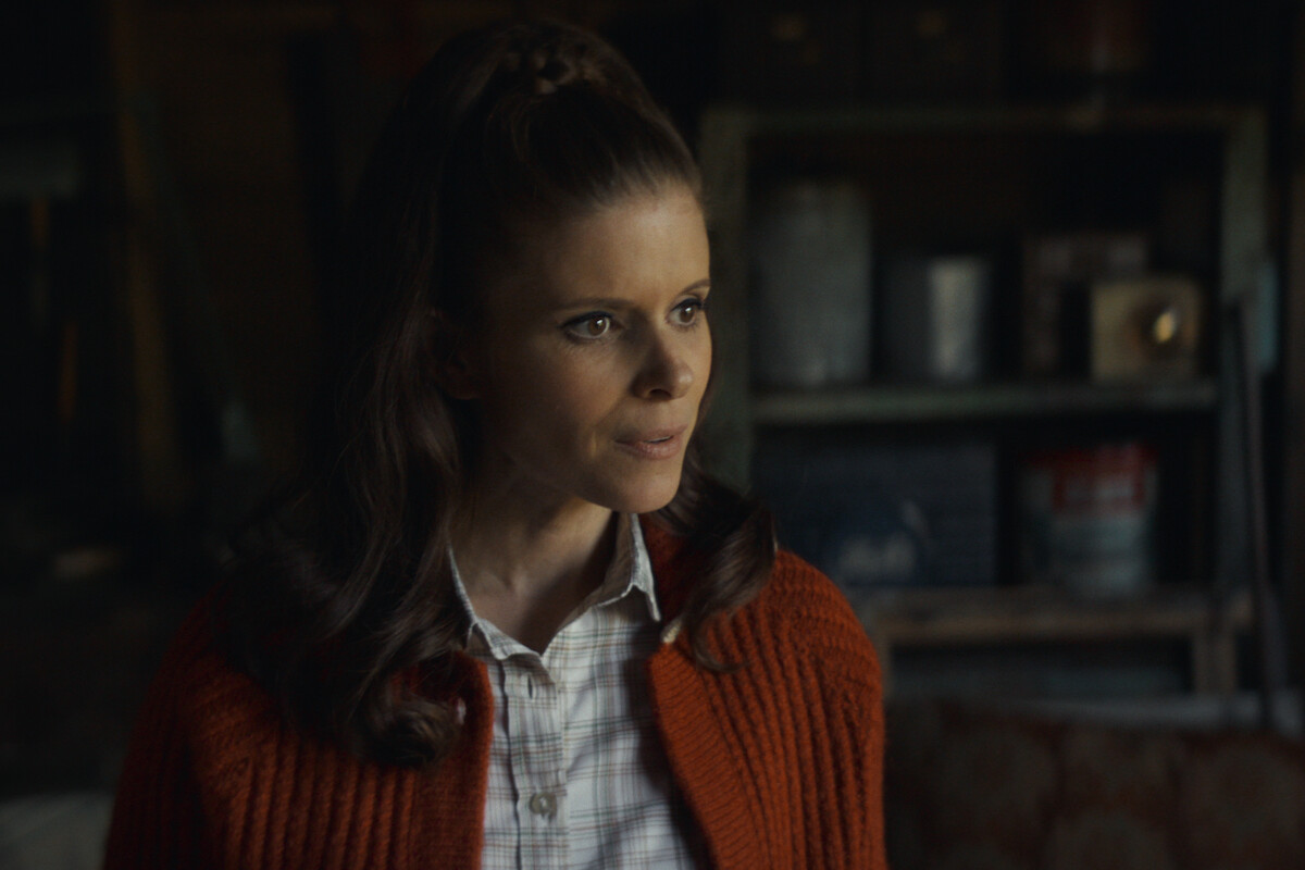 Kate Mara as Lana Stanfield in Black Mirror Season 6 in red sweater.