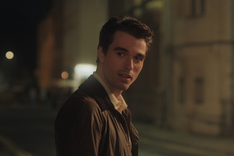 Corey Mylchreest as Jamie outside at night in 'My Oxford Year'.