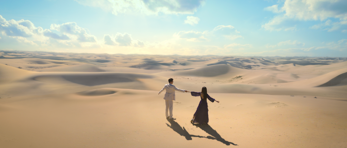 Iblis and Ka-young as Jinniya dance in the desert