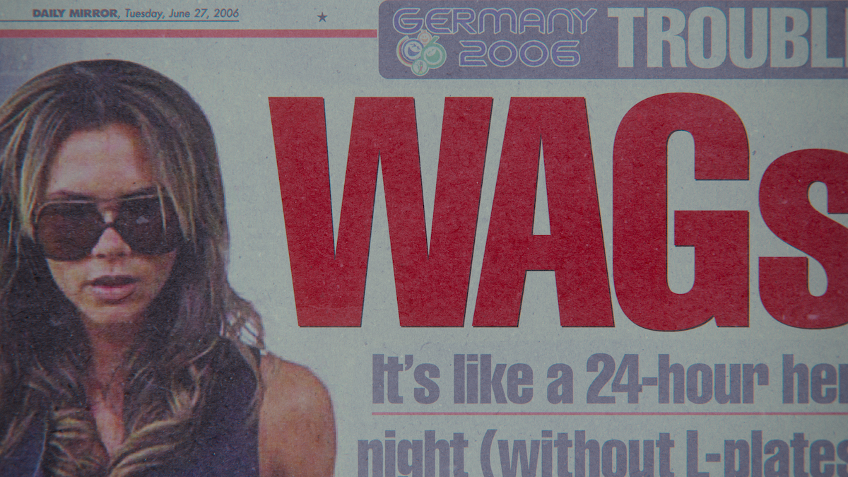 Front cover tabloid image of Victoria Beckham with the headline “WAGs.”