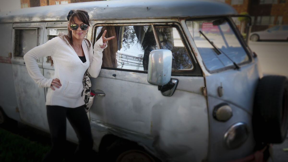 Amanda Antoni standing in front of a car.